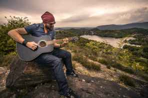 adult beard countryside guitar